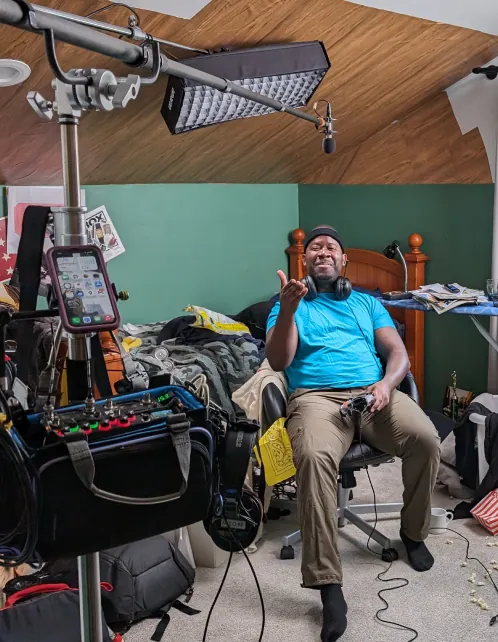 A sketch being filmed in a messy bedroom set